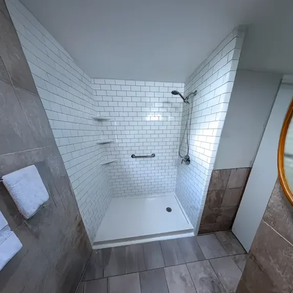 Accessibility bathroom with curbless shower and grab bars installed in Cecil County Maryland
